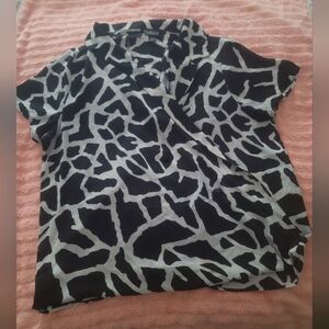 Medium black and white shirt.